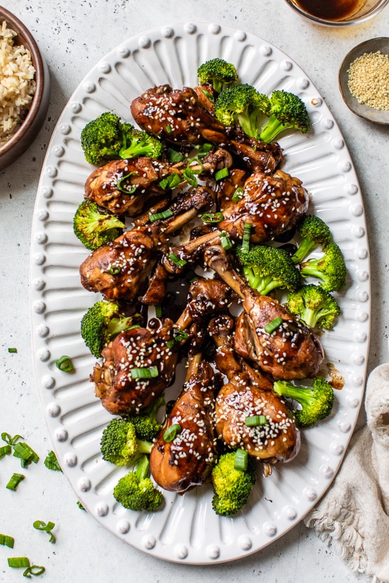 Soy sauce, vinegar and Sriracha hot sauce make these Asian-Glazed Chicken Drumsticks savory delicious – serve over rice or vegetables for an easy meal!