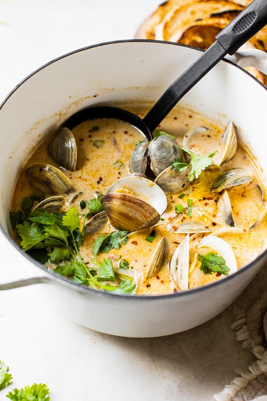 Asian Coconut Broth Clams made with lemongrass, ginger and cilantro is wonderful when paired with bread for dipping all that delicious broth!