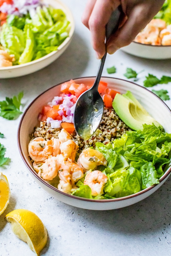 Lemon-Chili Shrimp Quinoa Bowls with lemon dressing.