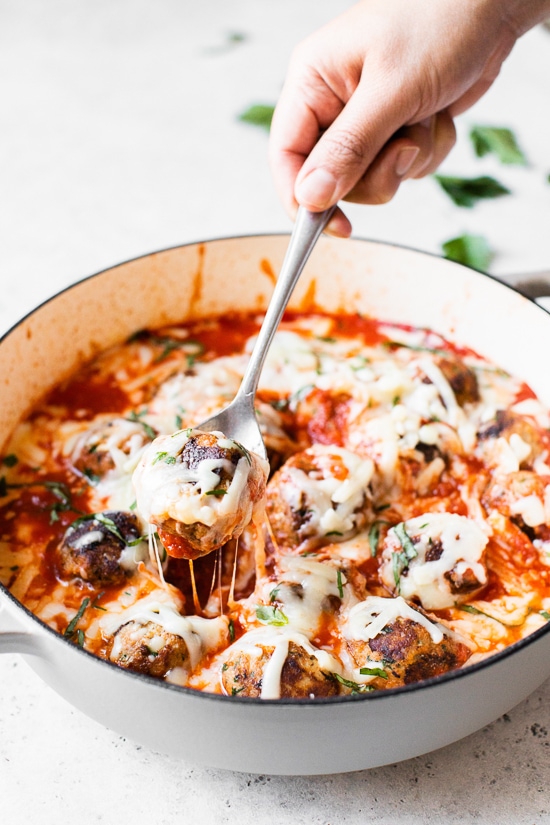 Cheesy Turkey Meatballs covered in sauce and cheese, made all in one skillet, serve this with a green salad and a little bread on the side for dipping!