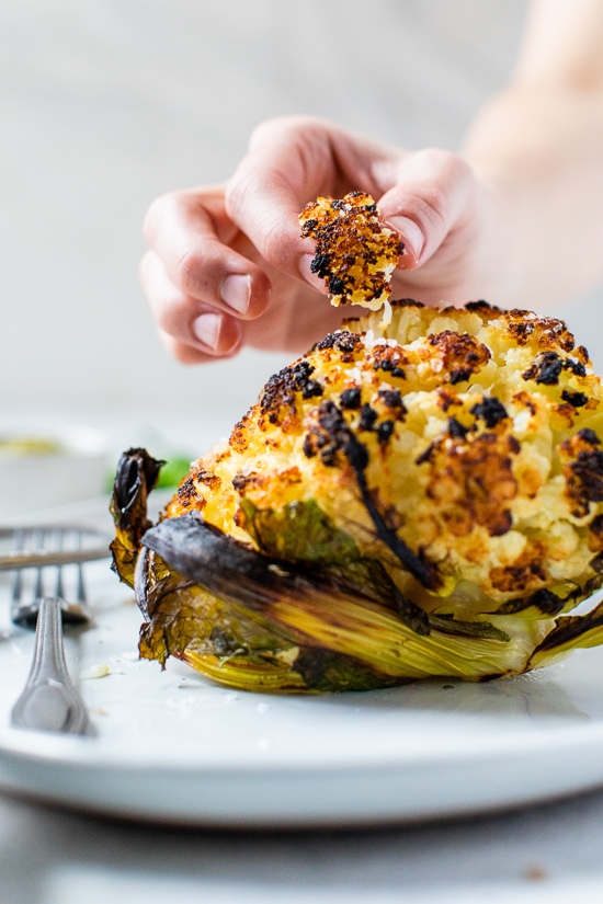 This simple, Whole Roasted Baby Cauliflower is perfectly charred on the outside and tender in the middle. Made with just four ingredients – salted water, extra-virgin olive oil, coarse sea salt—and cauliflower.