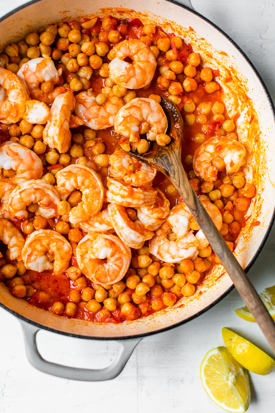 This easy Harissa Shrimp and Chickpea dish is super fast, made all in one skillet, and takes under 10 minutes to make. A great way to use pantry and freezer staples.