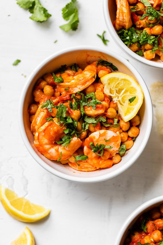 This easy Harissa Shrimp and Chickpea dish is super fast, made all in one skillet, and takes under 10 minutes to make. A great way to use pantry and freezer staples.