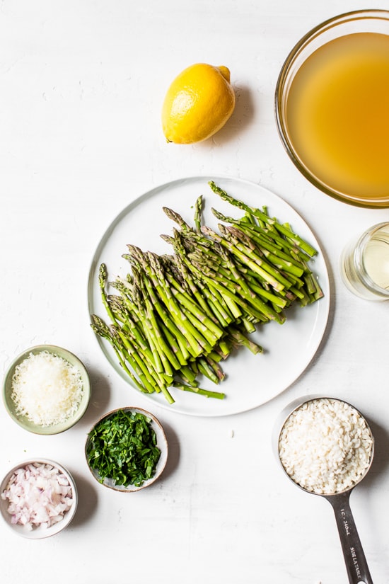 Creamy asparagus risotto, cooked with fresh herbs, Parmigiano-Reggiano and a touch of lemon. Perfect Spring meatless main dish or wonderful topped with grilled shrimp or scallops.