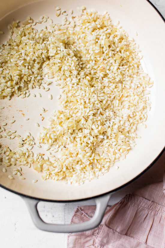 Creamy asparagus risotto, cooked with fresh herbs, Parmigiano-Reggiano and a touch of lemon. Perfect Spring meatless main dish or wonderful topped with grilled shrimp or scallops.