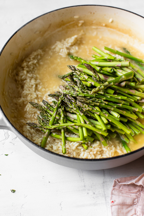 Creamy asparagus risotto, cooked with fresh herbs, Parmigiano-Reggiano and a touch of lemon. Perfect Spring meatless main dish or wonderful topped with grilled shrimp or scallops.