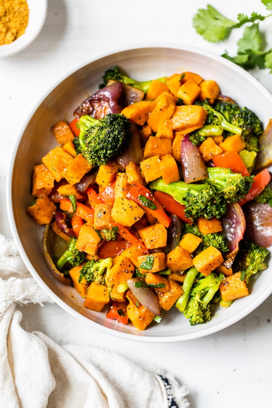 This nourishing Warm Curry Roasted Vegetable Salad with Honey Curry Dressing is a delicious vegetarian, gluten- and dairy-free dinner or make-ahead lunch.