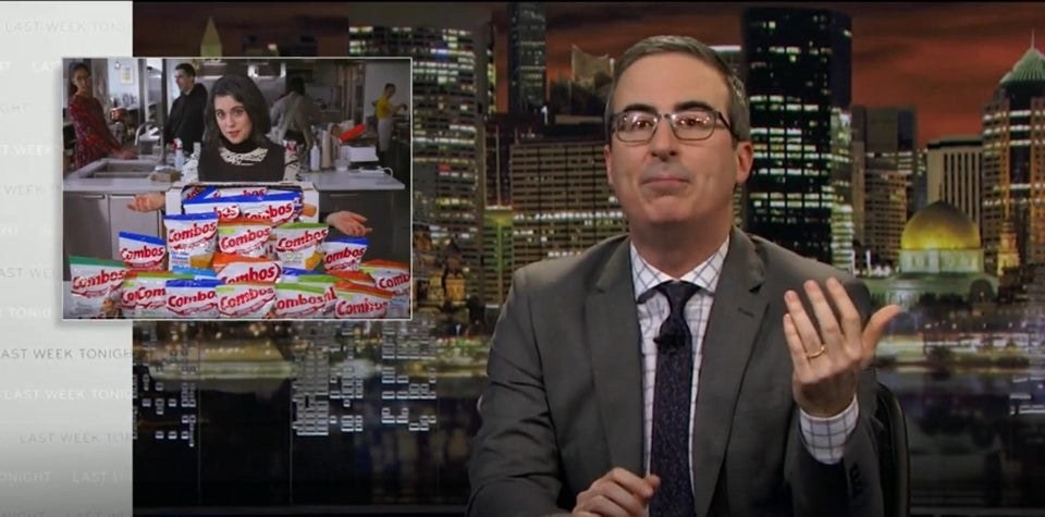 Image may contain John Oliver Tie Accessories Accessory Human Person City Metropolis Urban Town and Building