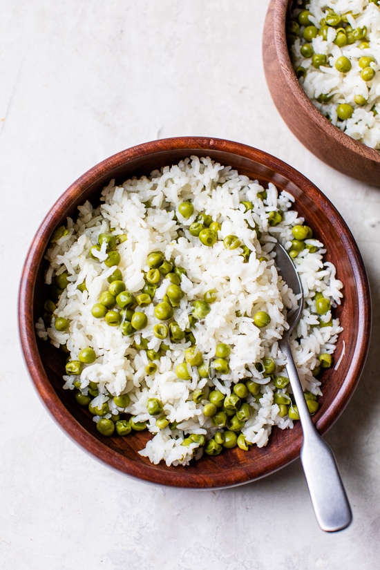 This simple Baked Rice and Peas dish uses pantry and freezer staples, a great side dish to go along with grilled shrimp or chicken.