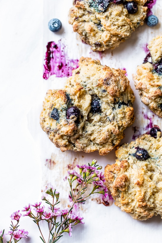 Lightened up, warm blueberry scones right out of the oven make the perfect Sunday morning breakfast along with a hot cup of tea.