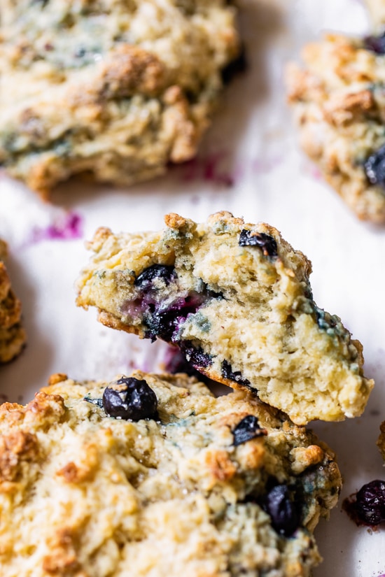 Lightened up, warm blueberry scones right out of the oven make the perfect Sunday morning breakfast along with a hot cup of tea.