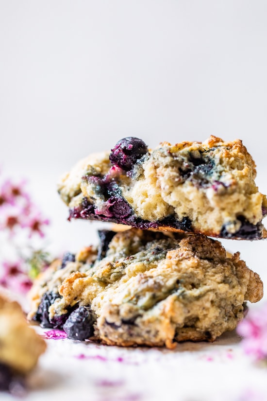 Lightened up, warm blueberry scones right out of the oven make the perfect Sunday morning breakfast along with a hot cup of tea.