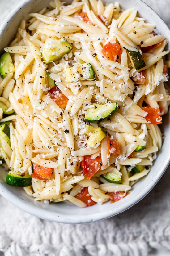 Orzo with Zucchini and Tomato is a quick and easy side dish that goes great with chicken, pork chops, or double the portion and enjoy it as a main dish.