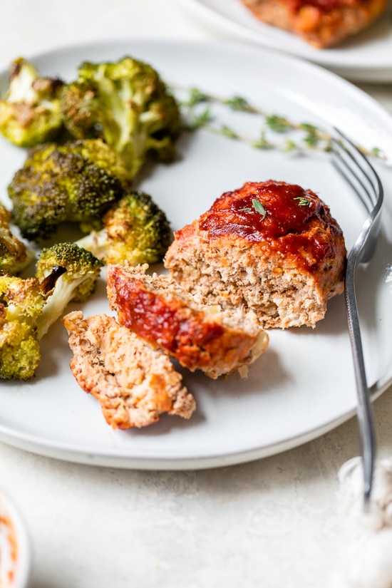 Sheet Pan Turkey Meatloaf and Broccoli made with individual loaves cooked on a foil-lined sheet pan for a quick meal with easy cleanup.