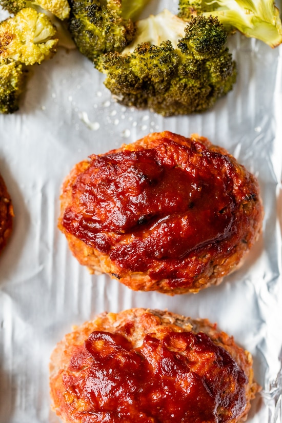 Sheet Pan Turkey Meatloaf and Broccoli made with individual loaves cooked on a foil-lined sheet pan for a quick meal with easy cleanup.