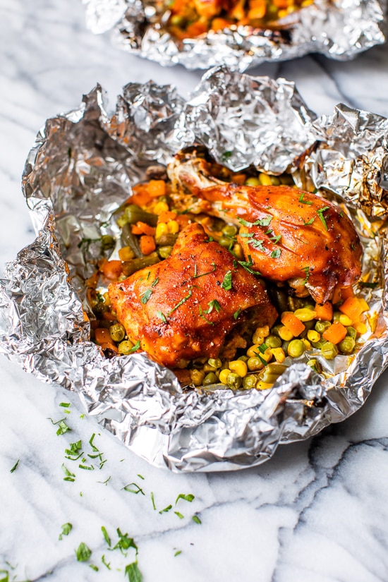 These easy 5-ingredient BBQ Chicken Foil Packets can be baked in the oven or made on the grill! An easy meal-in-one and the best part, easy cleanup!