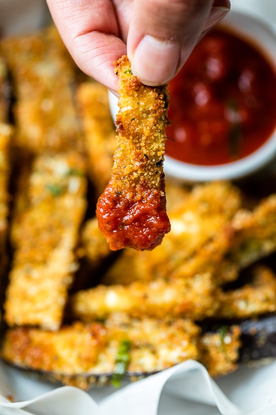 These Baked Eggplant Sticks are breaded with Italian breadcrumbs and Parmesan, baked or air-fried until golden, and served with a quick marinara sauce.