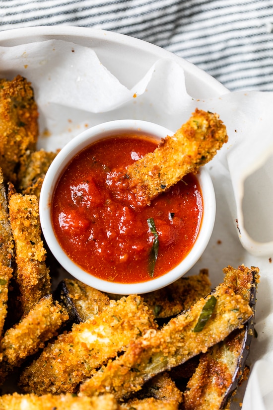 These Baked Eggplant Sticks are breaded with Italian breadcrumbs and Parmesan, baked or air-fried until golden, and served with a quick marinara sauce.