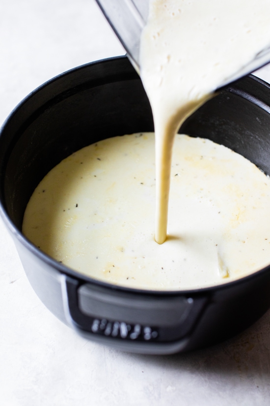 Pouring chowder into pot from blender