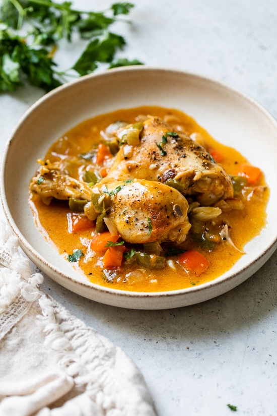 Paprika Chicken Stew is an easy weeknight dish made with chicken pieces on the bone, bell peppers, and lots of Hungarian paprika.