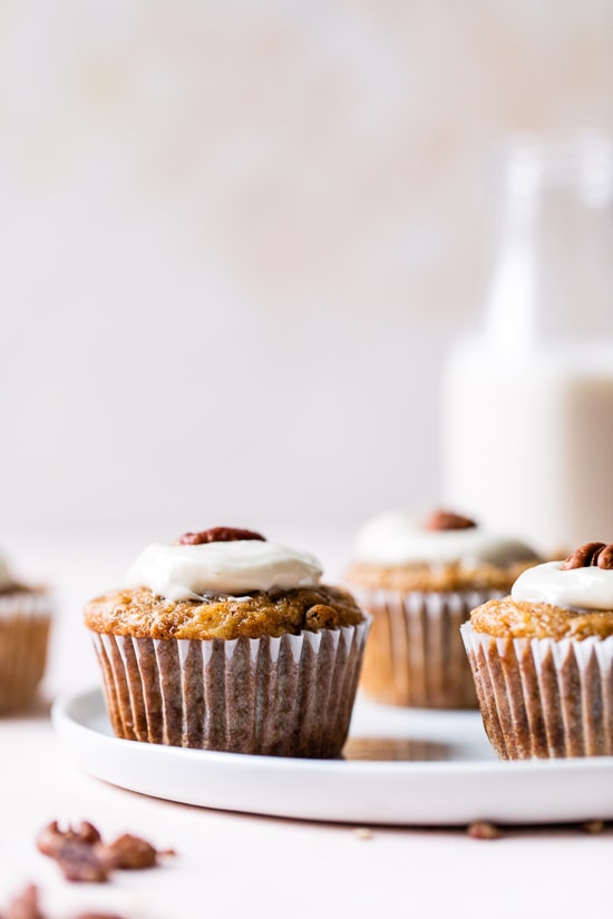 These super moist hummingbird cupcakes are light, full of pineapple, chopped bananas, pecans, cinnamon and spices topped off with a sweet cream cheese frosting.