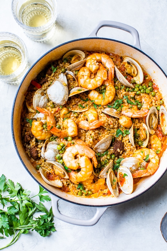 This easy seafood paella, made with shrimp, clams and chorizo is a delicious one-pot dish!