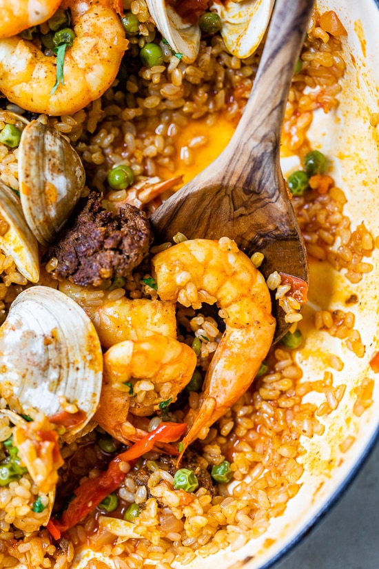 This easy seafood paella, made with shrimp, clams and chorizo is a delicious one-pot dish!