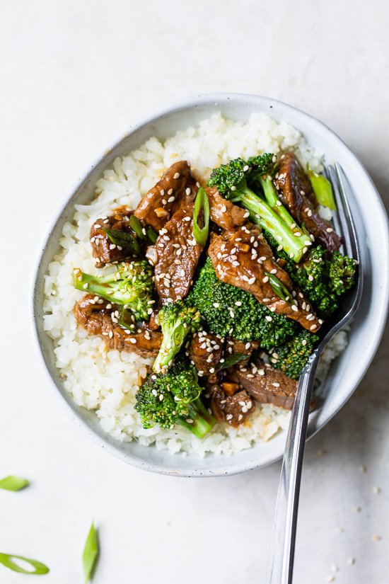 Broccoli Beef in a bowl with white rice.