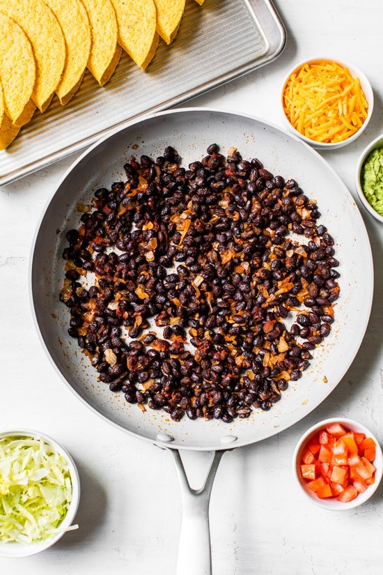 seasoned black beans in a skillet