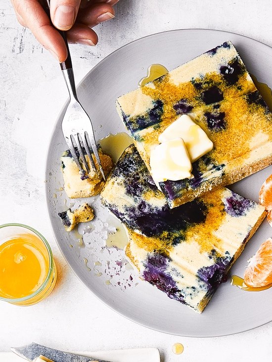 Lemon Blueberry Buttermilk Sheet Pan Pancakes on a plate with syrup.