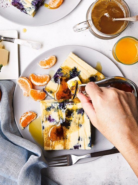 Lemon Blueberry Buttermilk Sheet Pan Pancakes on a plate with syrup.